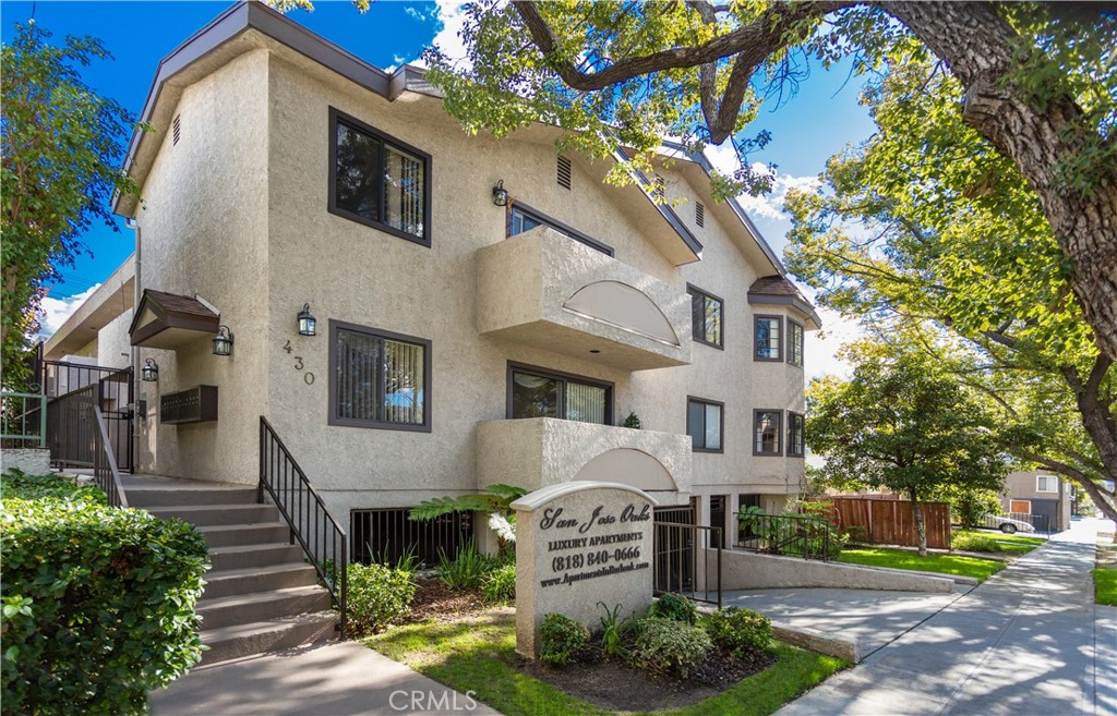 430 East San Jose Avenue, Unit F Burbank, CA 91501 - Photo 2 of 16 a front view of a house with a garden