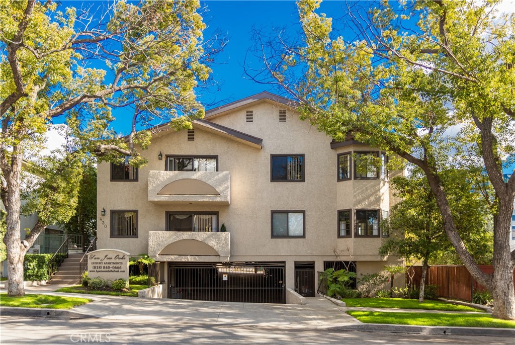 430 East San Jose Avenue, Unit F Burbank, CA 91501 - Photo 3 of 16 a front view of a house with a garden