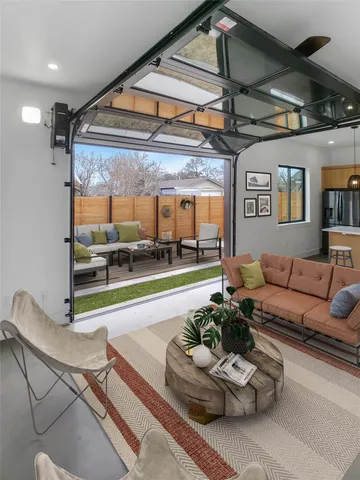 a living room with furniture and a table