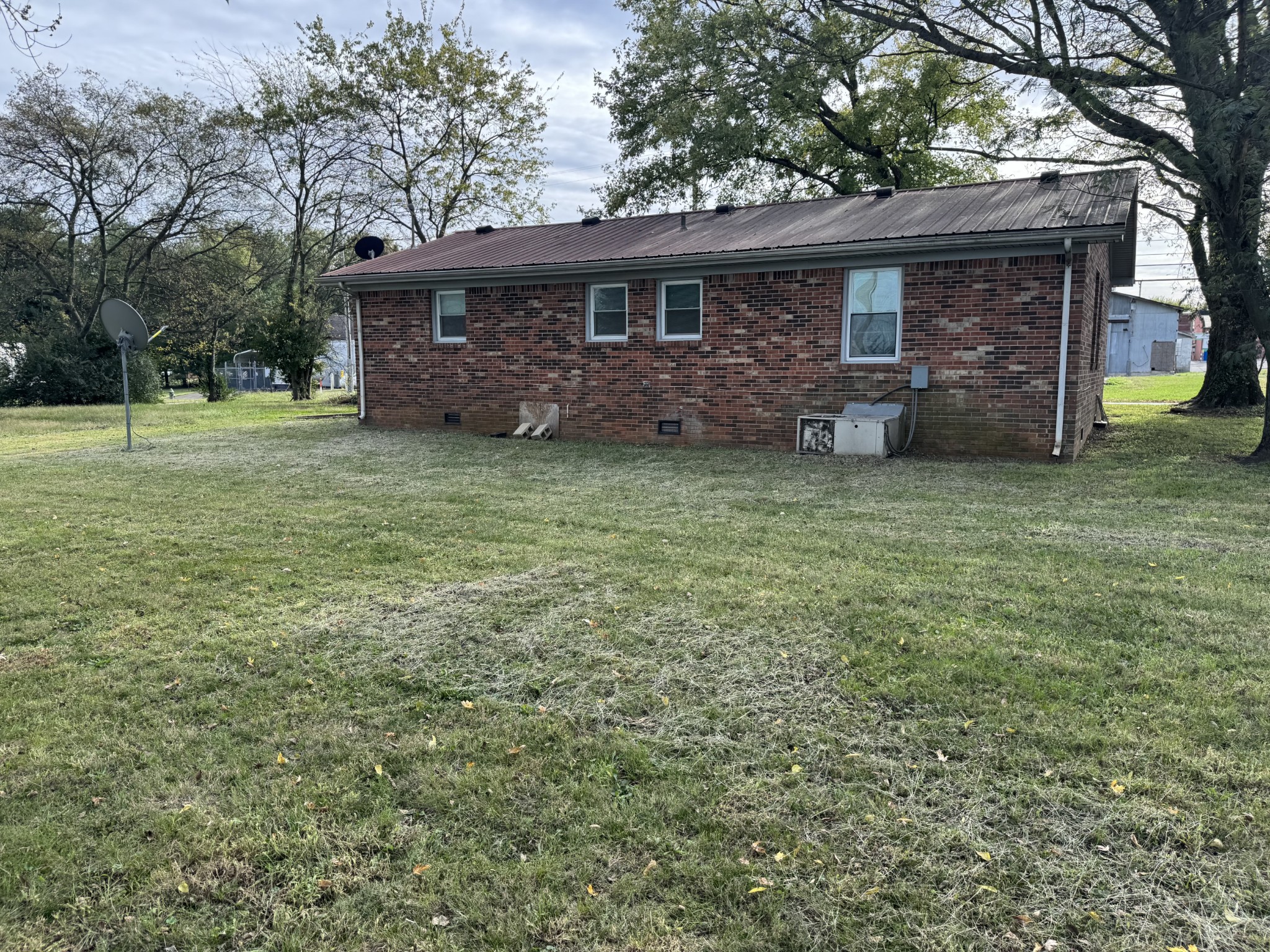 210 Rosenwald Street Trenton, KY 42286 - Photo 4 of 17 a front view of a house with a garden