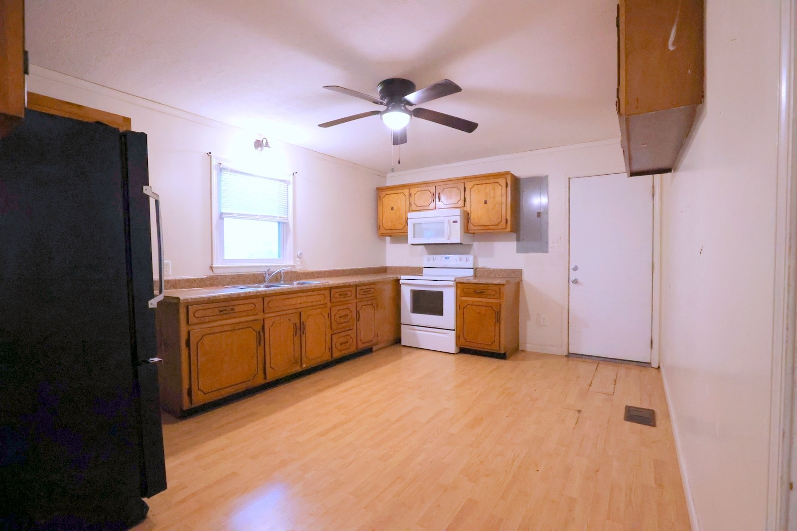 210 Rosenwald Street Trenton, KY 42286 - Photo 5 of 17 a kitchen with stainless steel appliances a sink and a refrigerator