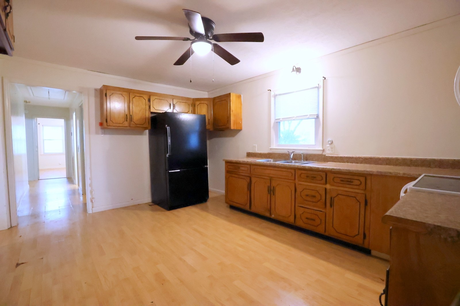 210 Rosenwald Street Trenton, KY 42286 - Photo 6 of 17 a kitchen with granite countertop a refrigerator and a sink