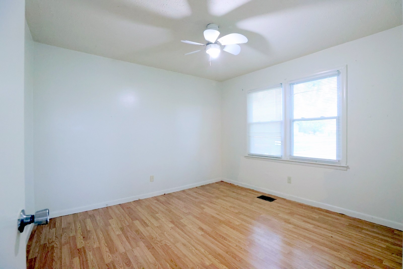 210 Rosenwald Street Trenton, KY 42286 - Photo 9 of 17 wooden floor in an empty room with a window