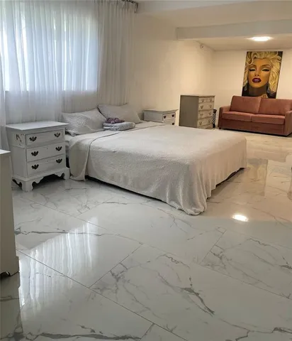 a bedroom with a bed and furniture