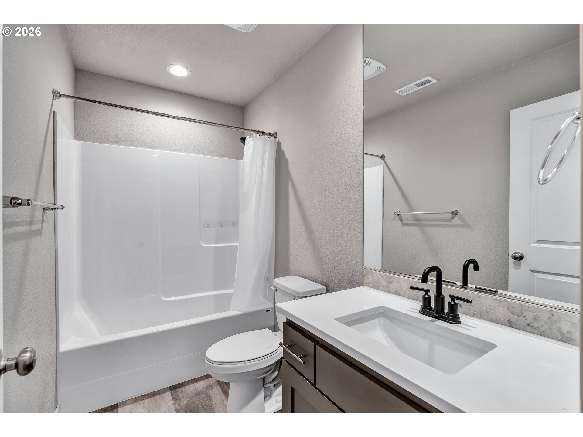 12706 Southeast Zion Street Boring, OR 97089 - Photo 16 of 34 a bathroom with a sink toilet a mirror and shower