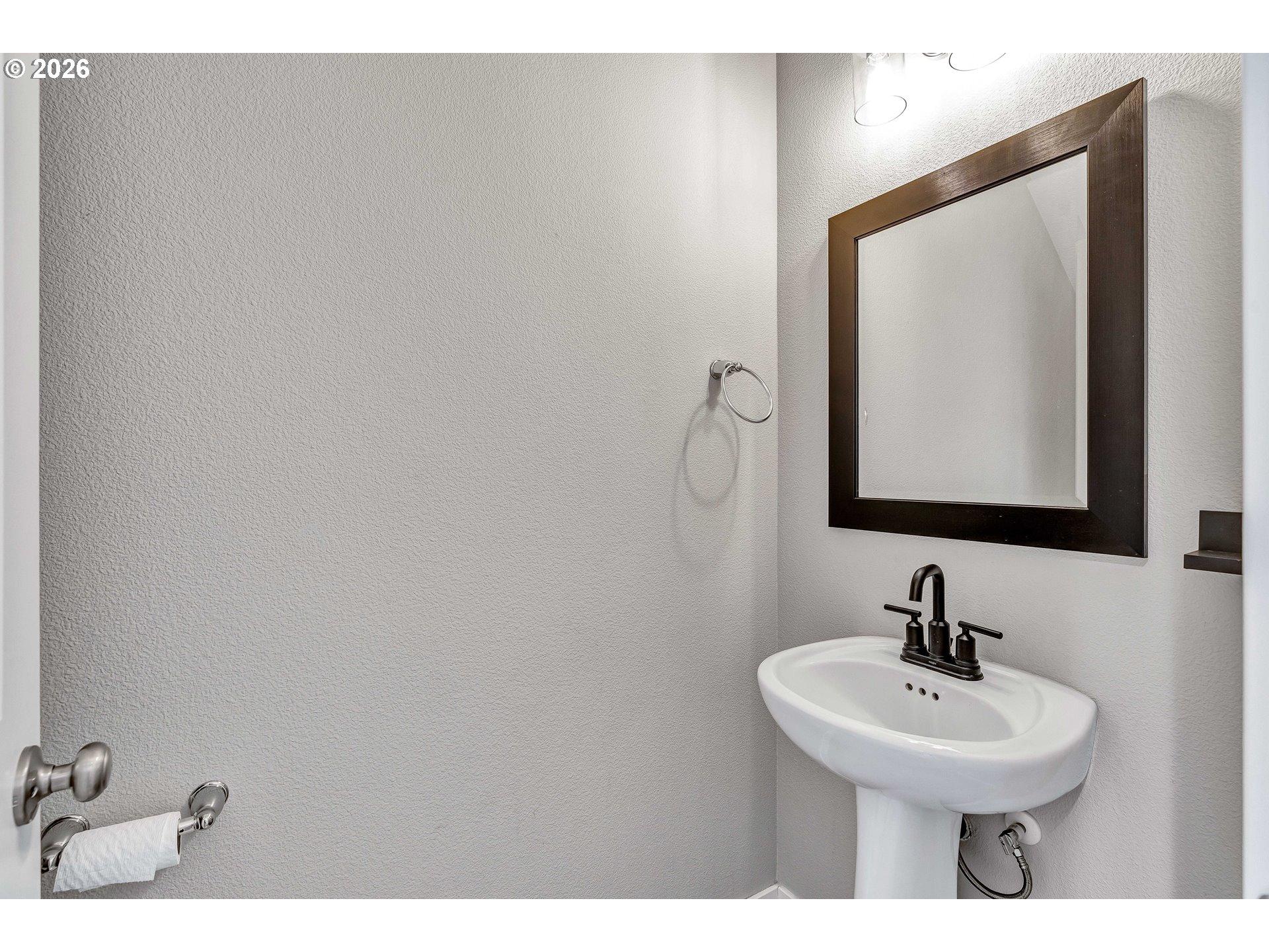 12706 Southeast Zion Street Boring, OR 97089 - Photo 5 of 34 a bathroom with a sink and a mirror