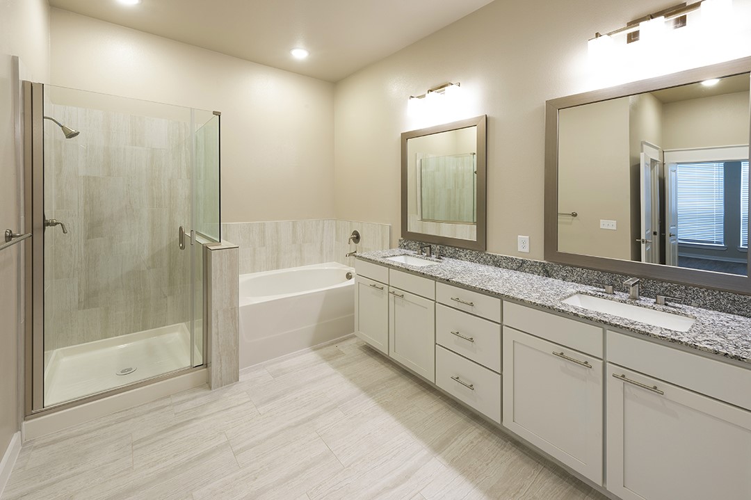 1724 Partnership Way, Unit 3103 Katy, TX 77449 - Photo 27 of 34 a spacious bathroom with a shower a sink and mirror