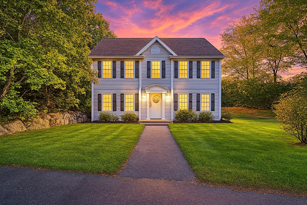 7 Babson Street Gloucester, MA 01930 - Photo 1 of 22 a front view of a brick house with a yard