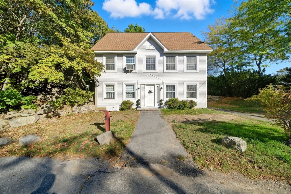 7 Babson Street Gloucester, MA 01930 - Photo 18 of 22 a front view of a house with a yard and trees