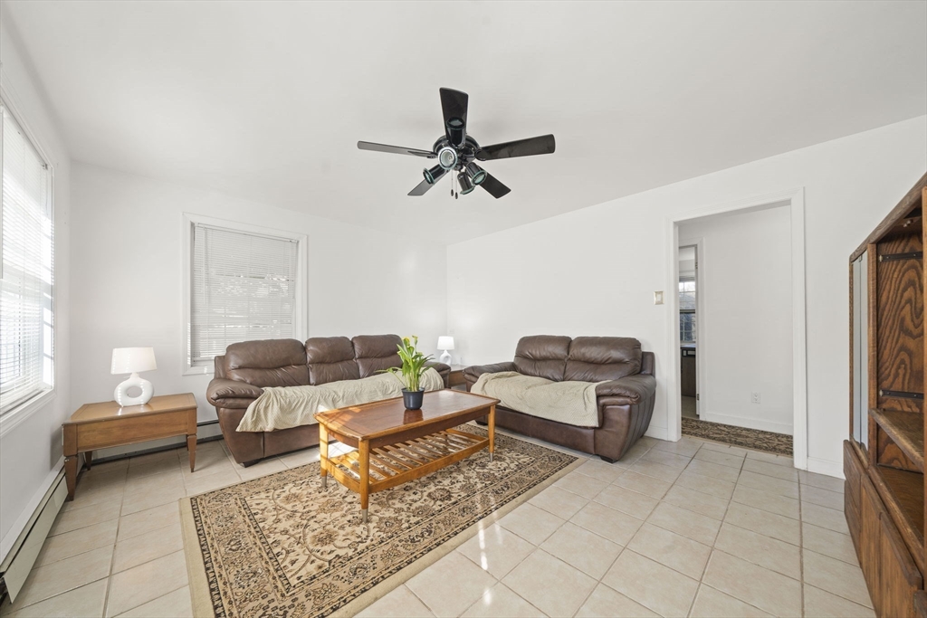 7 Babson Street Gloucester, MA 01930 - Photo 7 of 22 a living room with furniture and a rug