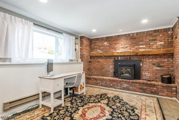 a living room with a fireplace and a table