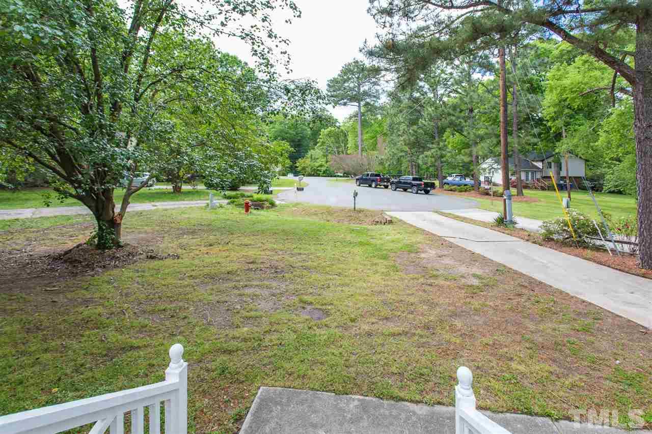 5508 Wettaw Lane Raleigh, NC 27616 - Photo 30 of 30 a view of yard with swimming pool and green space