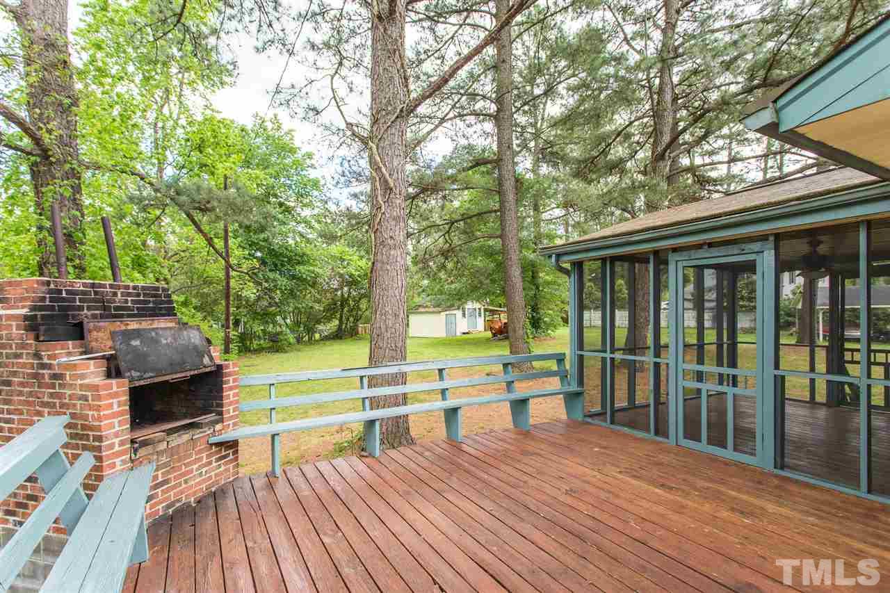 5508 Wettaw Lane Raleigh, NC 27616 - Photo 6 of 30 a view of house with deck outdoor seating and covered with trees