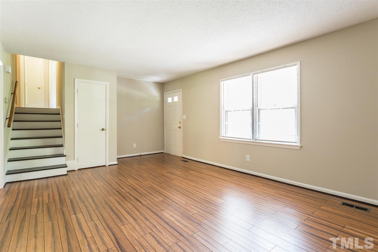 5508 Wettaw Lane Raleigh, NC 27616 - Photo 9 of 30 an empty room with wooden floor and windows
