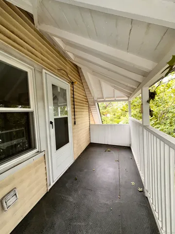 a view of a hallway with stairs