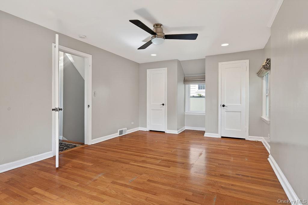 155 White Road Scarsdale, NY 10583 - Photo 15 of 30 a view of empty room with wooden floor and ceiling fan