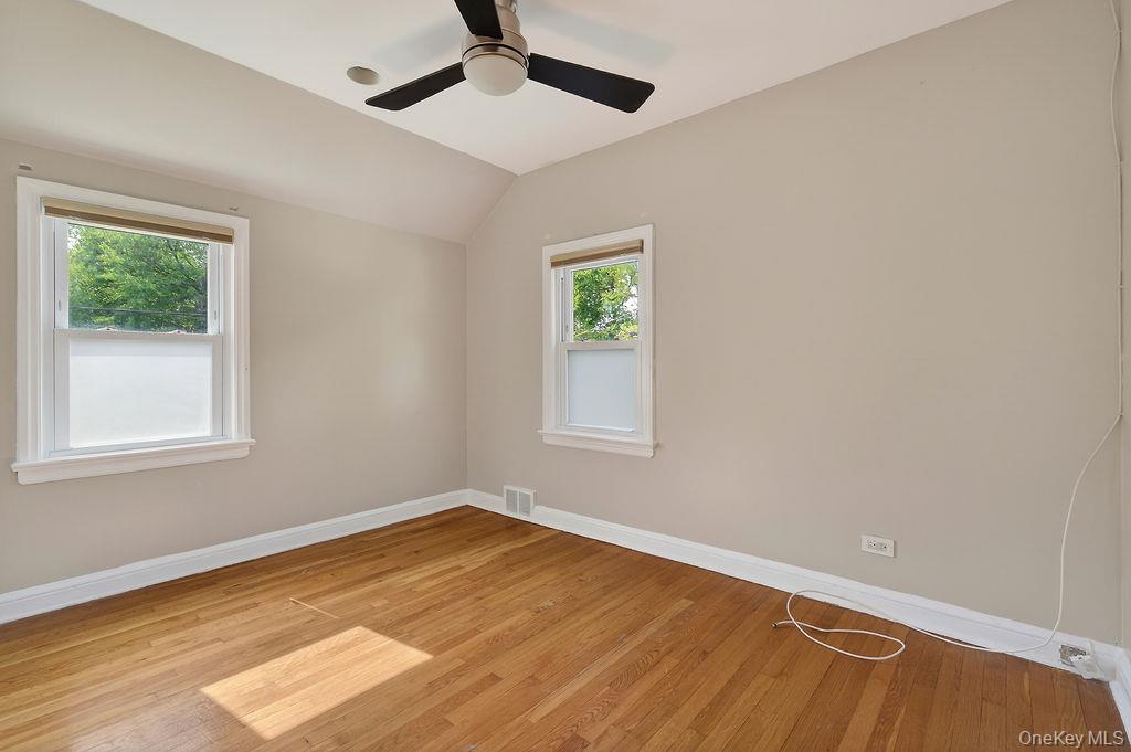155 White Road Scarsdale, NY 10583 - Photo 17 of 30 a view of empty room with wooden floor and fan