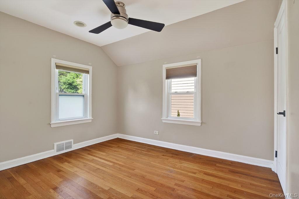 155 White Road Scarsdale, NY 10583 - Photo 18 of 30 a view of an empty room with wooden floor and a window