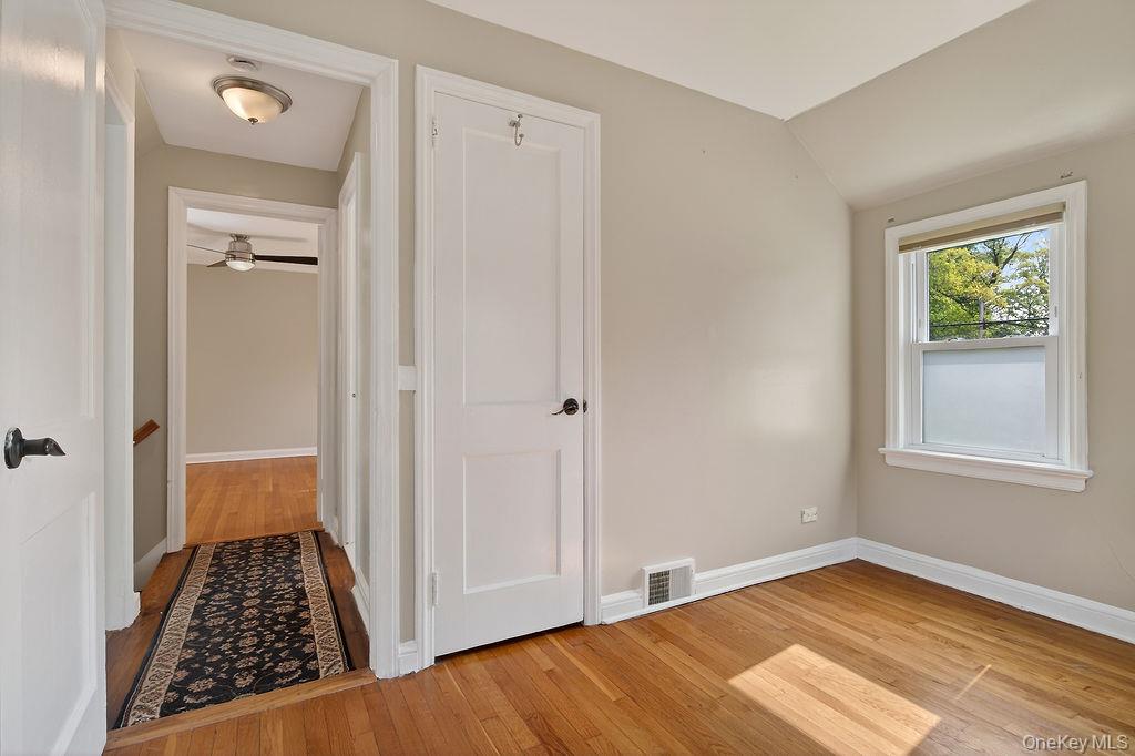 155 White Road Scarsdale, NY 10583 - Photo 19 of 30 a view of room with window and hardwood floor