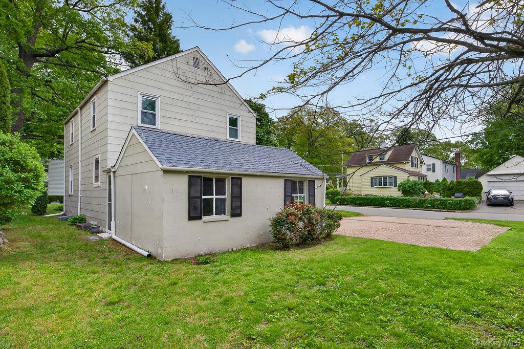 155 White Road Scarsdale, NY 10583 - Photo 28 of 30 a view of a house with garden and yard