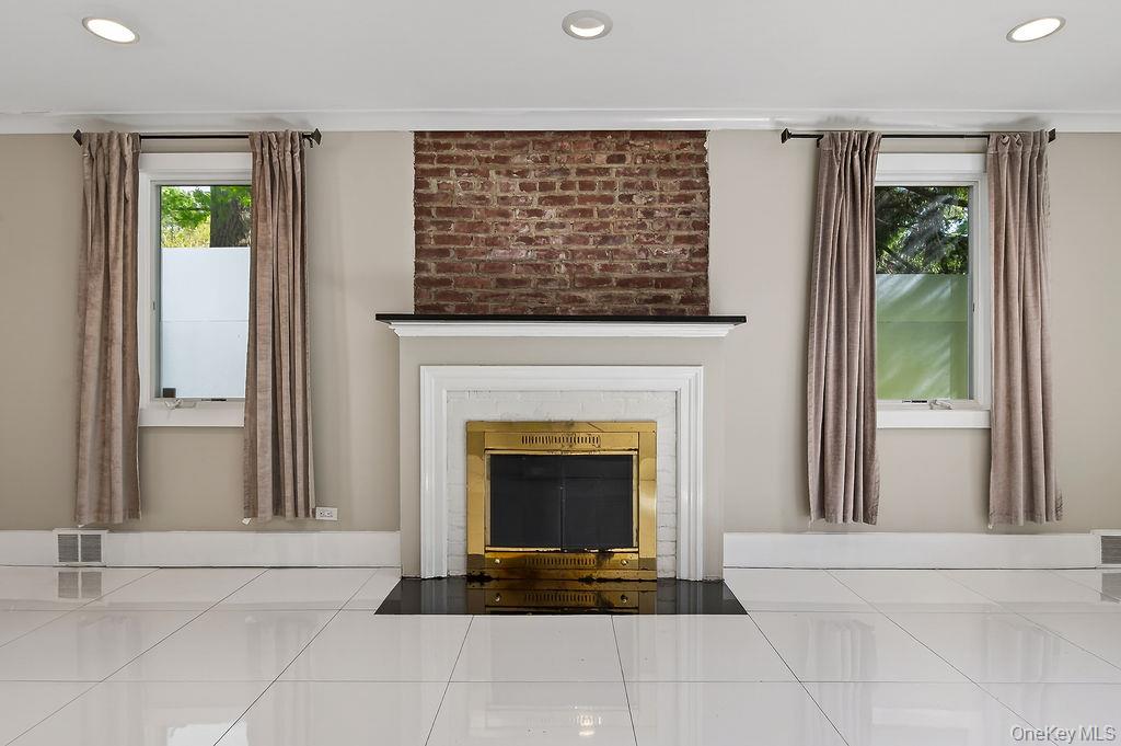 155 White Road Scarsdale, NY 10583 - Photo 3 of 30 a living room with furniture and a fireplace