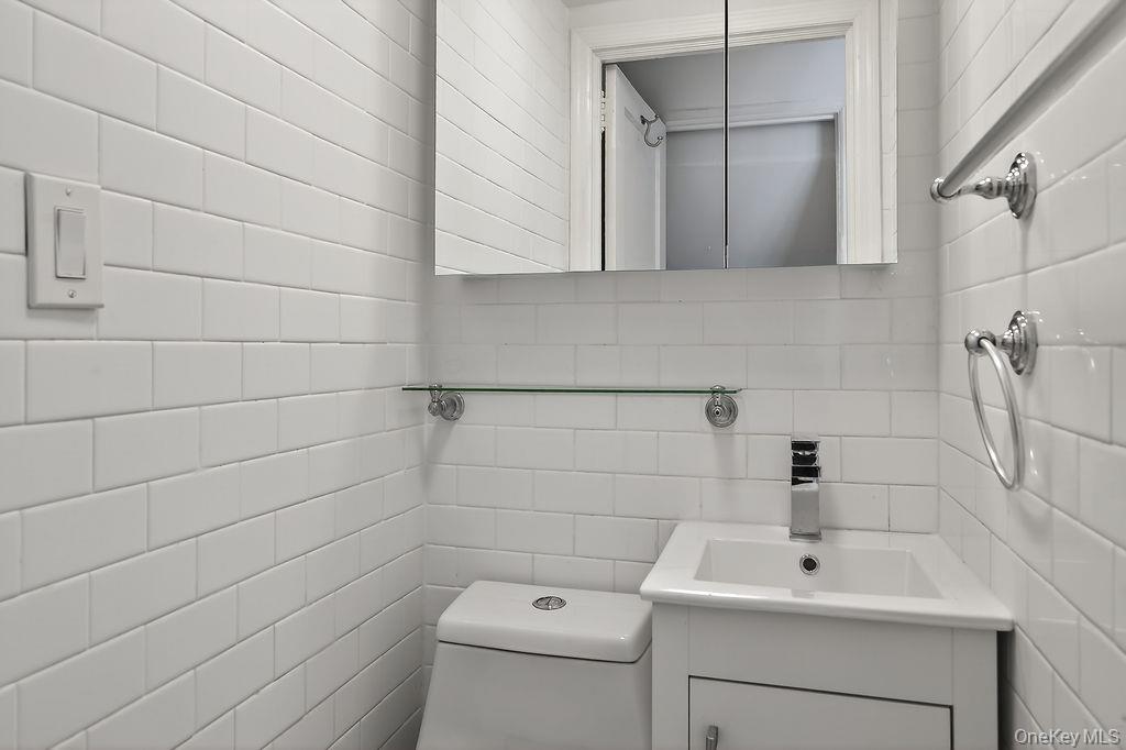 155 White Road Scarsdale, NY 10583 - Photo 9 of 30 a bathroom with a sink toilet and vanity