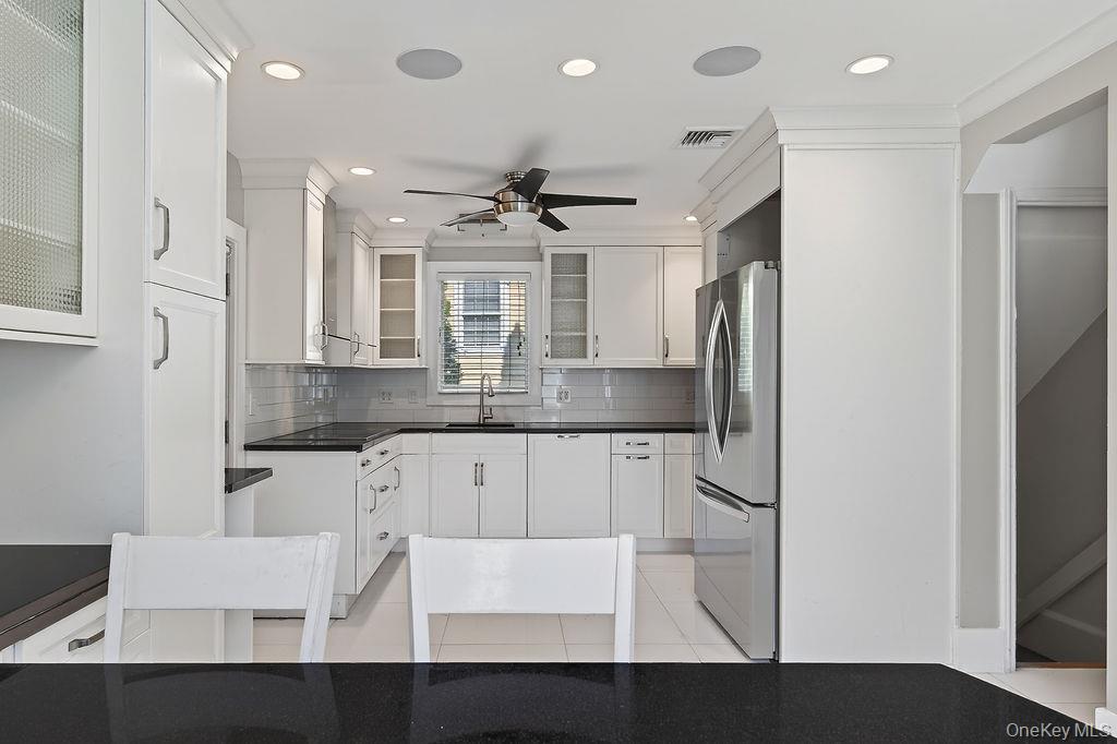 155 White Road Scarsdale, NY 10583 - Photo 10 of 30 a kitchen with kitchen island stainless steel appliances a sink and cabinets