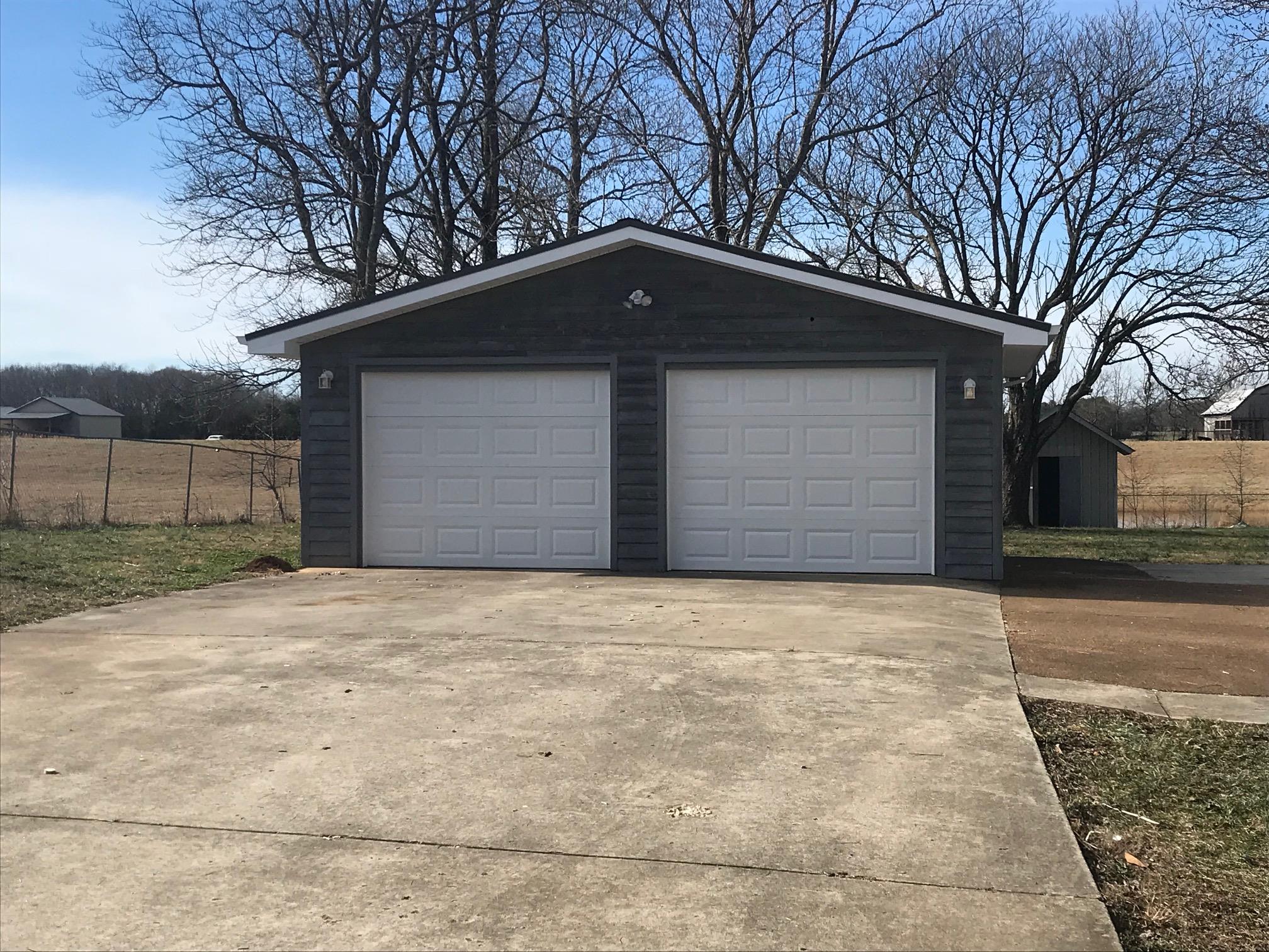 951 Lockmiller Road Winchester, TN 37398 - Photo 2 of 18 a front view of a house with a yard and garage