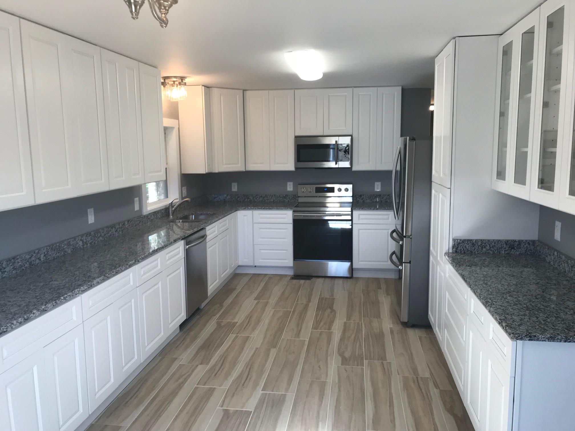 951 Lockmiller Road Winchester, TN 37398 - Photo 4 of 18 a kitchen with stainless steel appliances granite countertop a stove a sink and a refrigerator