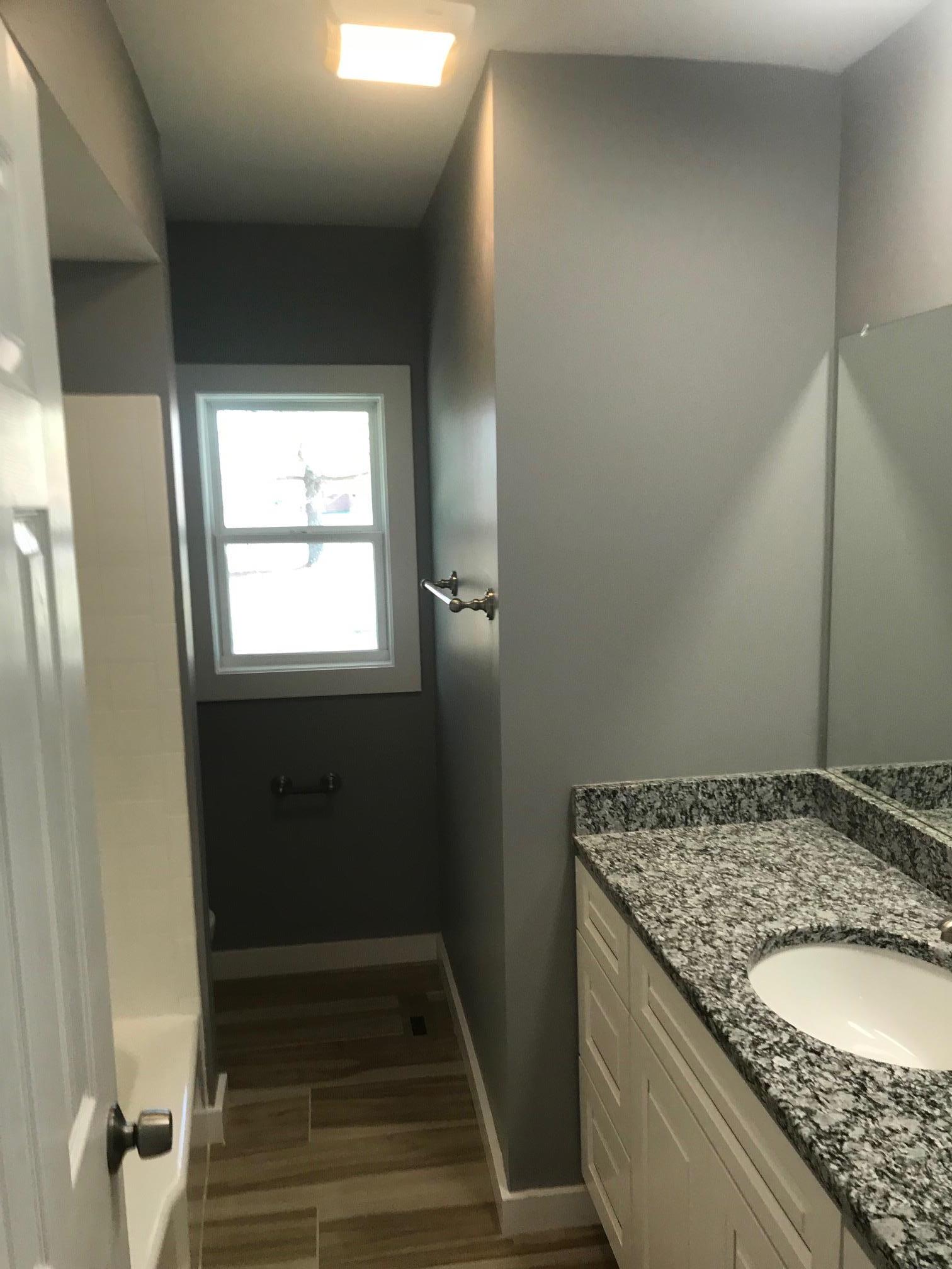 951 Lockmiller Road Winchester, TN 37398 - Photo 9 of 18 a bathroom with a granite countertop sink and a mirror