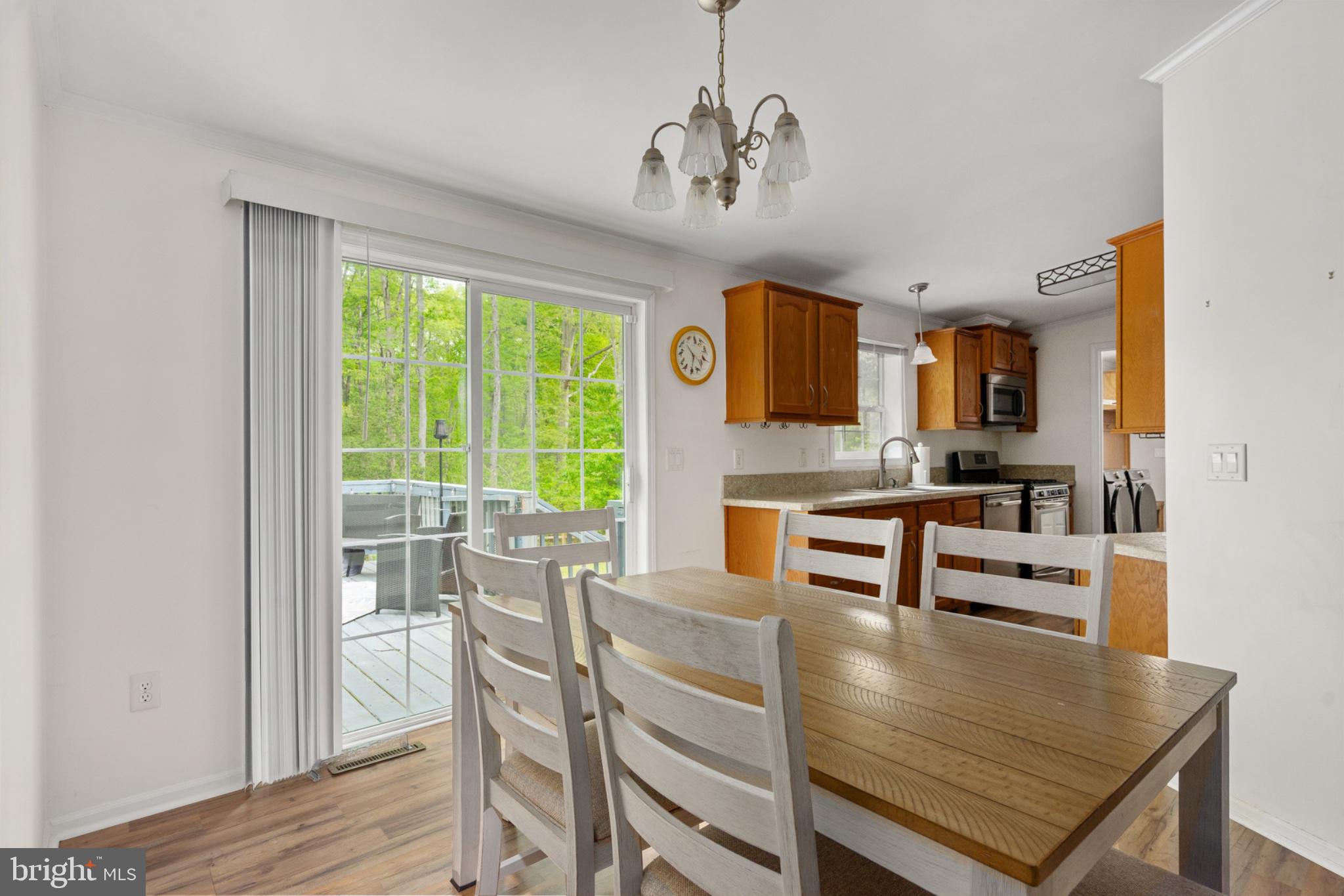 2319 Sizer Road Beaverdam, VA 23015 - Photo 25 of 61 a view of a dining room with furniture window and wooden floor