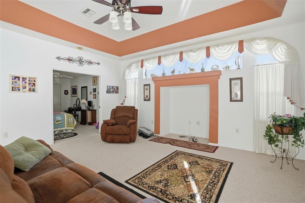 12054 Conway Street Spring Hill, FL 34609 - Photo 12 of 49 a living room with furniture and a rug