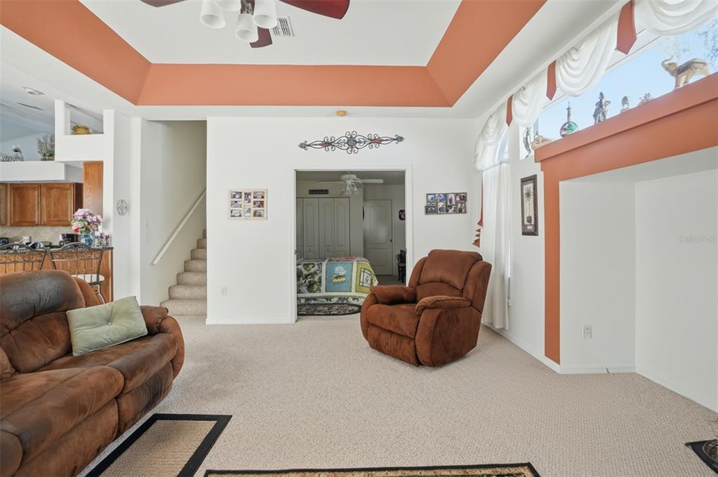 12054 Conway Street Spring Hill, FL 34609 - Photo 13 of 49 a living room with furniture and a lamp