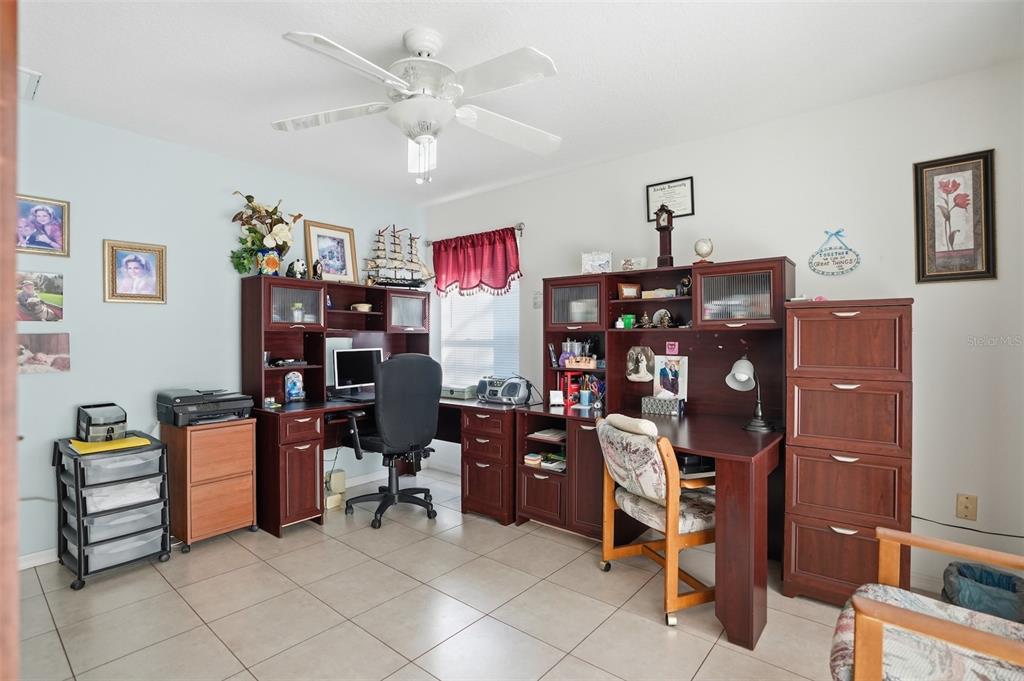 12054 Conway Street Spring Hill, FL 34609 - Photo 19 of 49 a view of a workspace with furniture