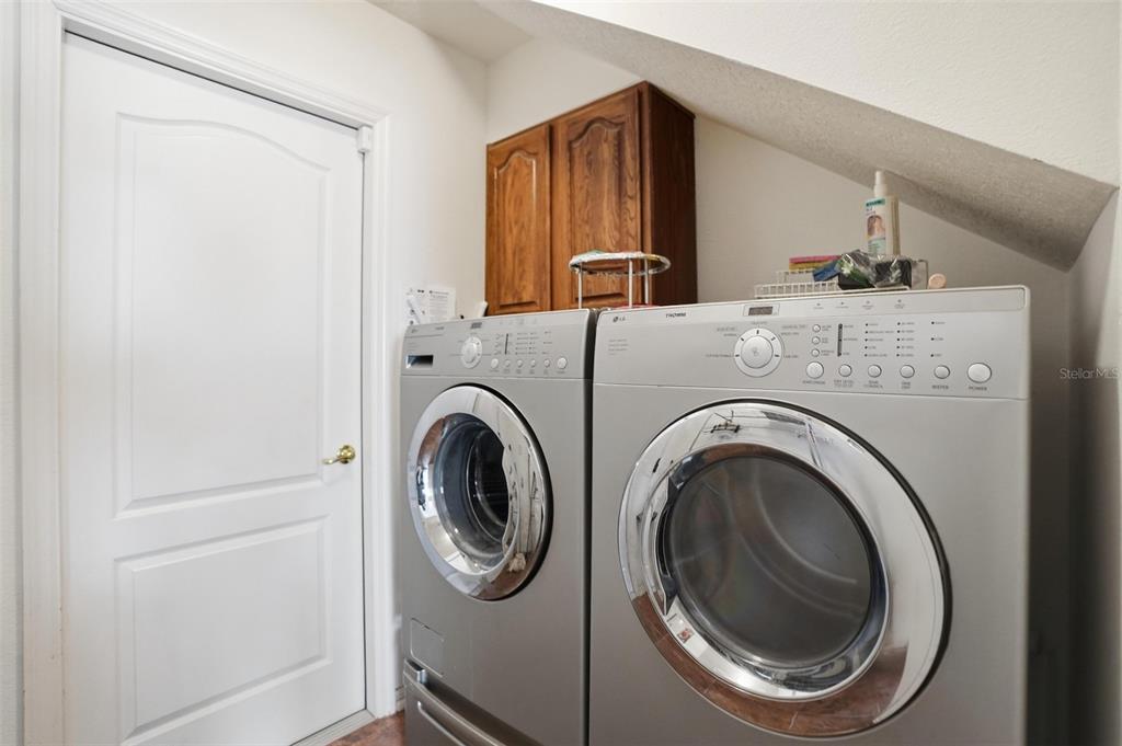 12054 Conway Street Spring Hill, FL 34609 - Photo 25 of 49 a utility room with dryer and washer