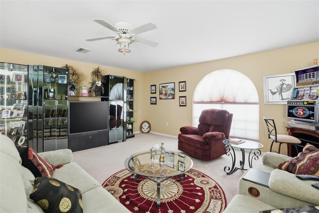 12054 Conway Street Spring Hill, FL 34609 - Photo 28 of 49 a living room with furniture and a large window