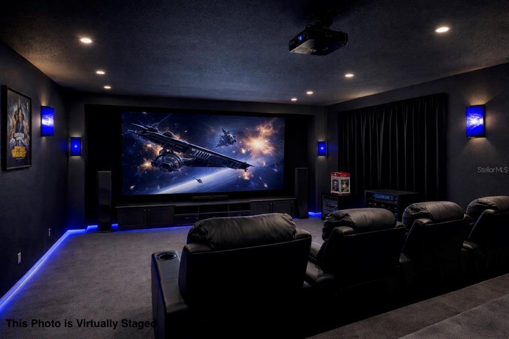 12054 Conway Street Spring Hill, FL 34609 - Photo 29 of 49 a room with furniture projector and screen