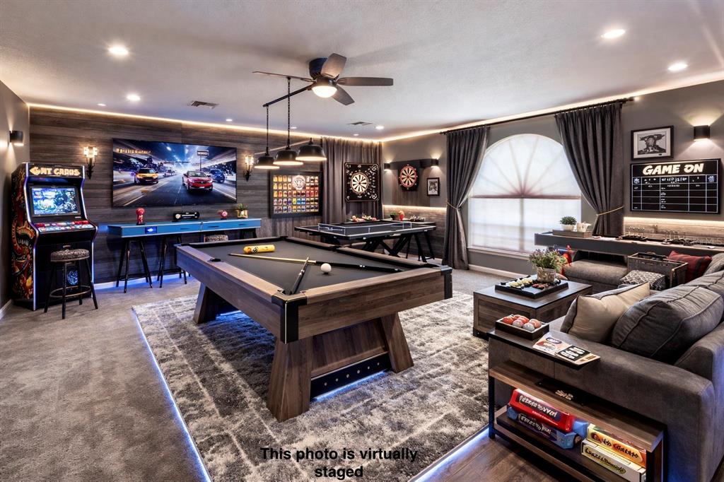 12054 Conway Street Spring Hill, FL 34609 - Photo 30 of 49 a living room with furniture a large window and a flat screen tv