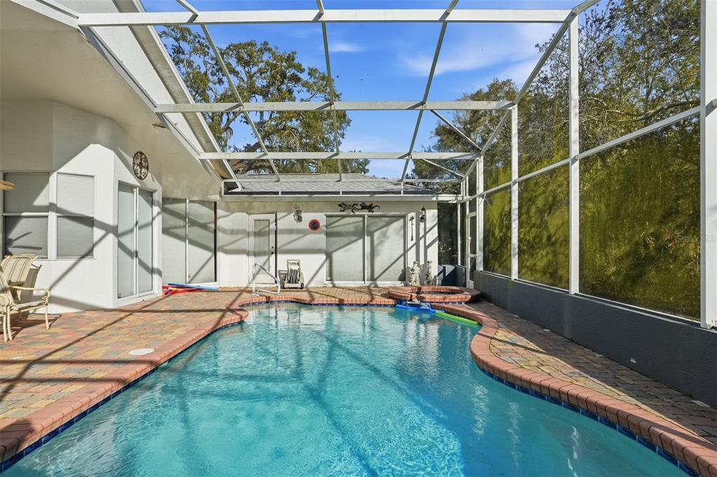 12054 Conway Street Spring Hill, FL 34609 - Photo 35 of 49 a view of a swimming pool with a yard