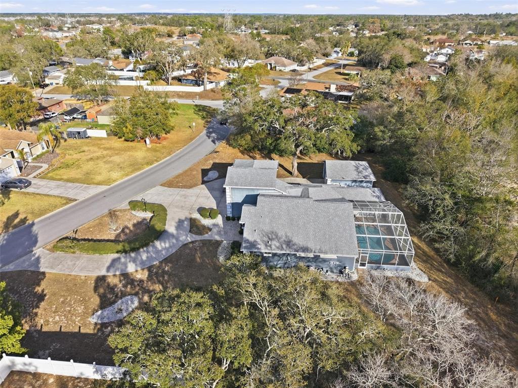 12054 Conway Street Spring Hill, FL 34609 - Photo 41 of 49 an aerial view of residential houses with outdoor space