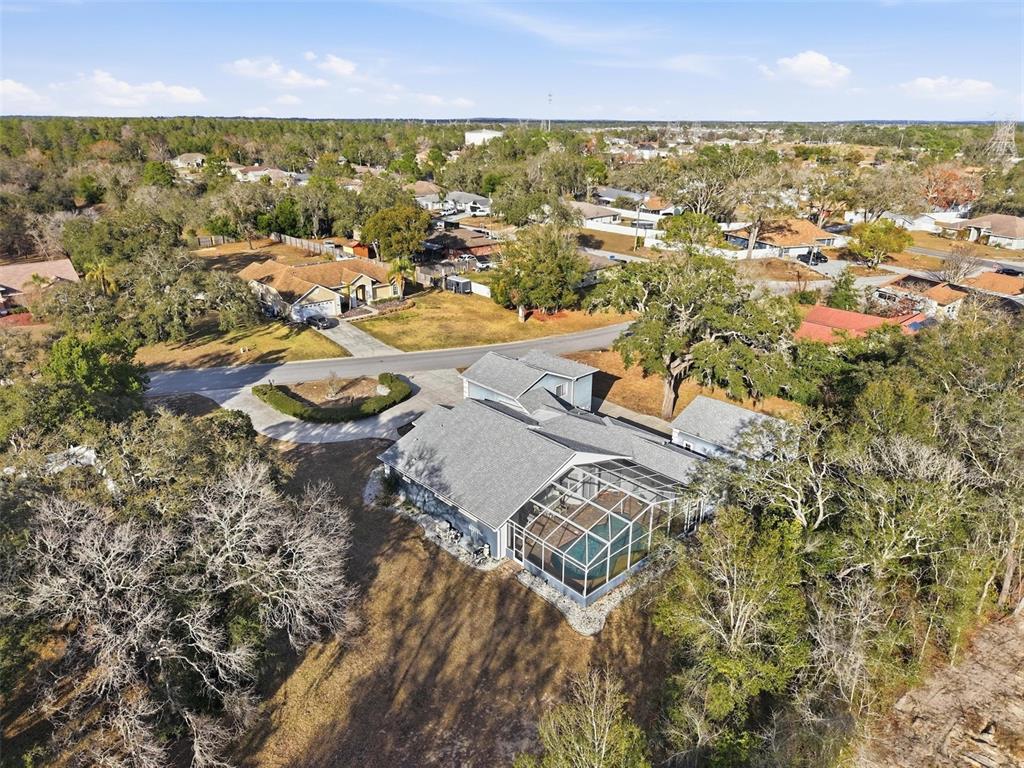 12054 Conway Street Spring Hill, FL 34609 - Photo 42 of 49 an aerial view of residential houses with outdoor space