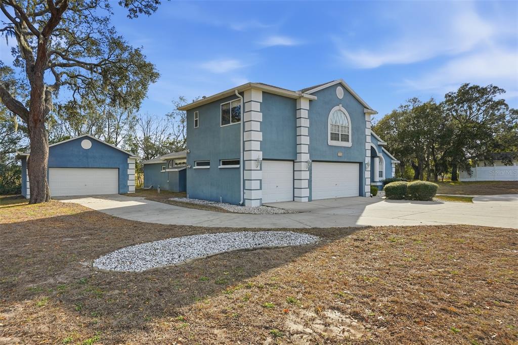 12054 Conway Street Spring Hill, FL 34609 - Photo 48 of 49 a view of a house with a yard