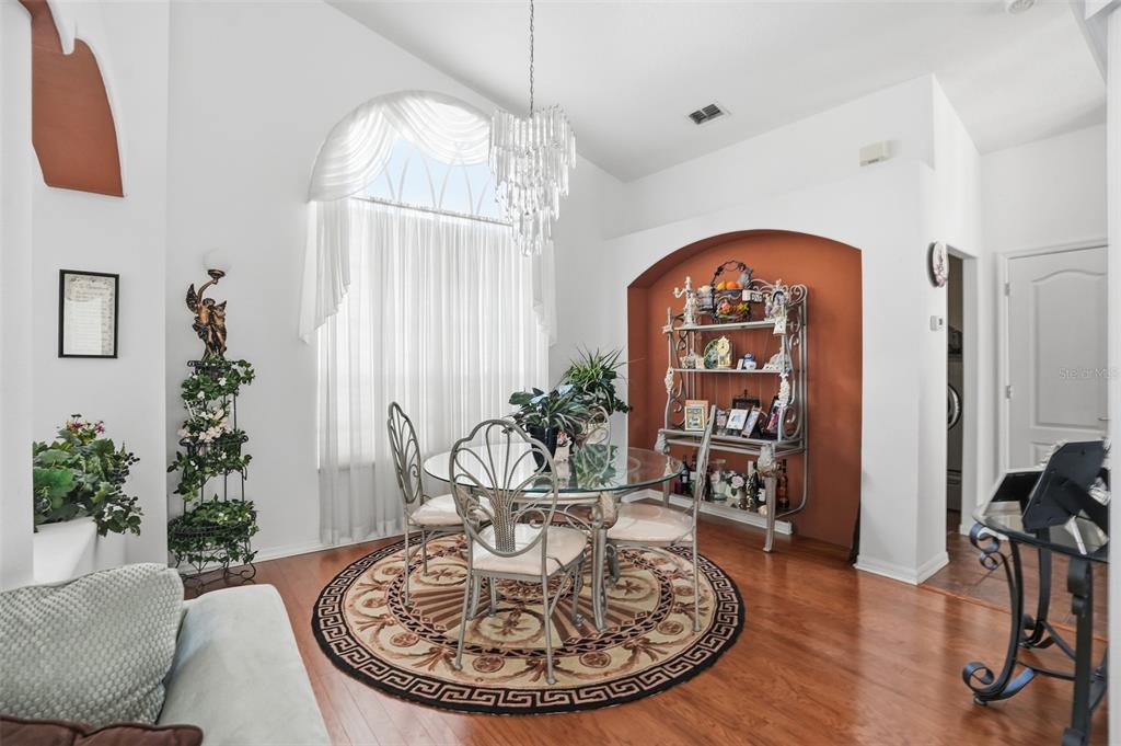 12054 Conway Street Spring Hill, FL 34609 - Photo 5 of 49 a view of a livingroom with furniture and a chandelier