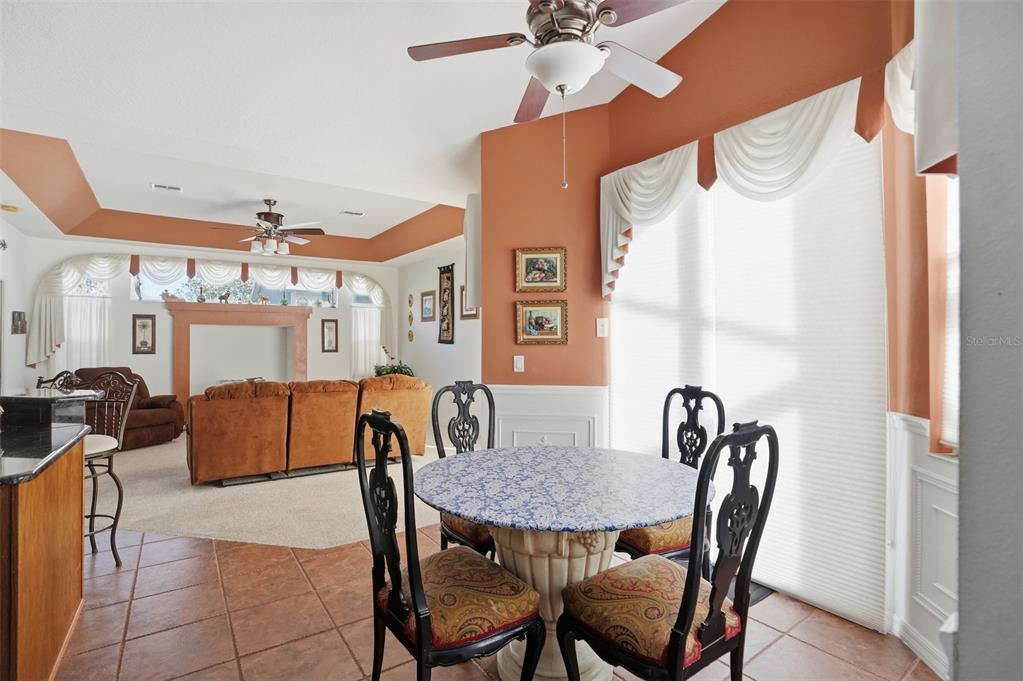 12054 Conway Street Spring Hill, FL 34609 - Photo 10 of 49 a view of a dining room with furniture