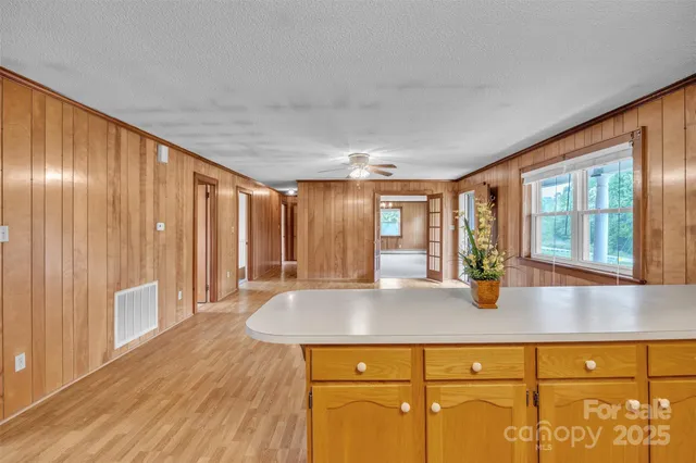 a view of kitchen with wooden floor and window