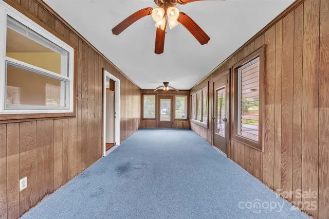 a view of a hallway with windows