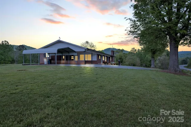 a view of a house with a big yard
