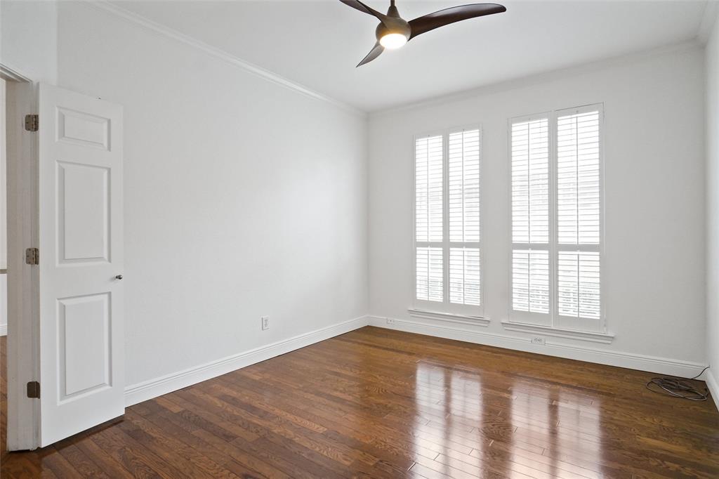 1229 Wooded Trail Hurst, TX 76053 - Photo 13 of 28 Flex room with double French doors for office, 2nd living, or 3rd bedroom with crown molding, and ceiling fan.