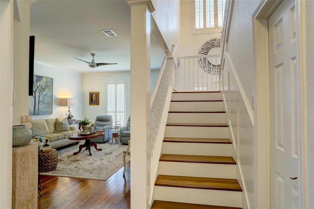 1229 Wooded Trail Hurst, TX 76053 - Photo 17 of 28 Stairway with wood-type flooring and a ceiling fan