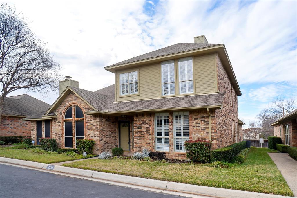 1229 Wooded Trail Hurst, TX 76053 - Photo 2 of 28 View of front of property featuring a chimney, a front lawn, and brick siding